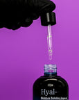 Hand with black glove holding a dropper over a bottle labeled 'Dr.Esthe Hyal- Moisture Solution Ampoule' against a purple background