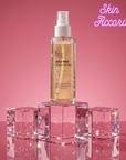 Kx Jelly Mist bottle on pink cubes with 'Skin Accord' text on a pink background