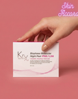 Hand holding a Kryx Aesthetics Biophase Night Peel box against a pink background