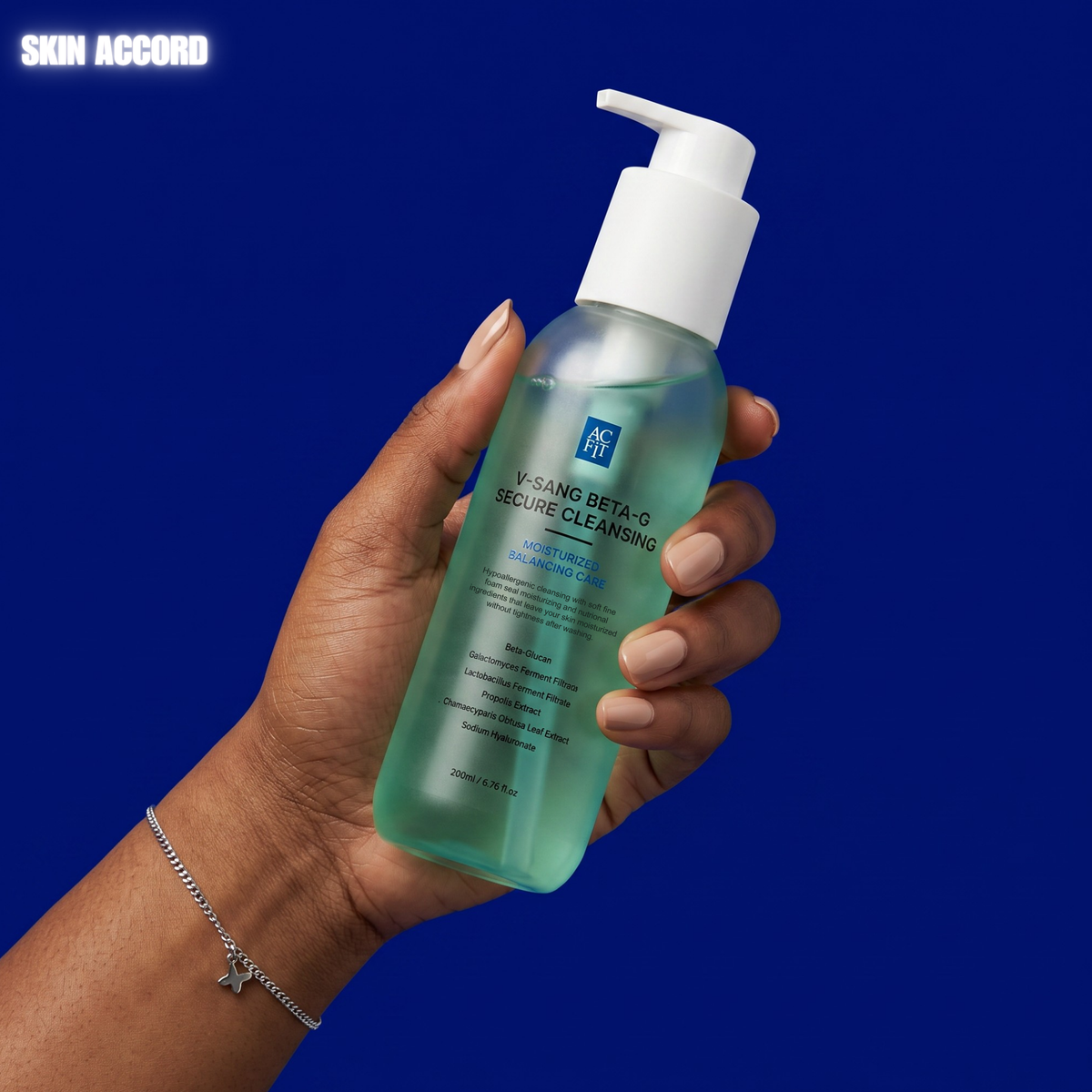 hand holding AC Fit V Sang Beta Secure Cleanser against a blue background