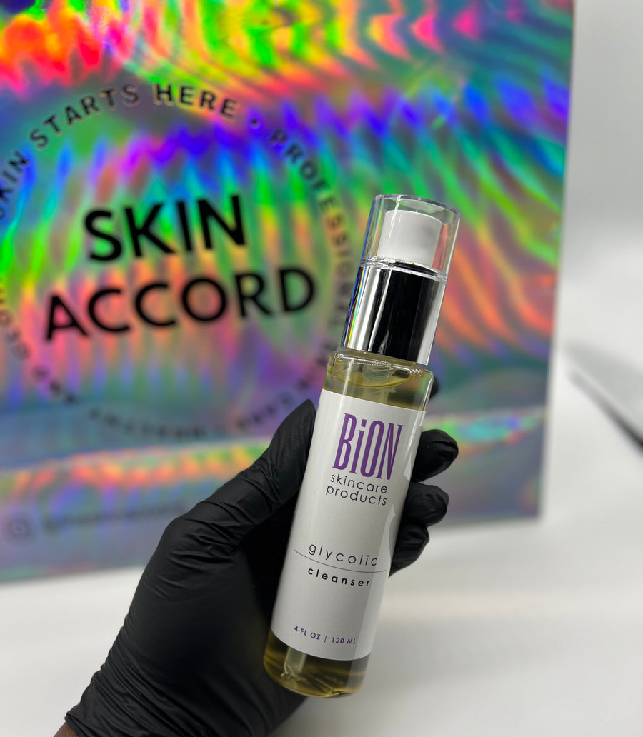 Picture of esthetician hand holding Bion Glycolic Cleanser at Skin Accord 