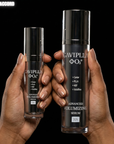 Two hands holding CAVIPLLA +O2 Advanced Volumizing Serum bottles against a black background.