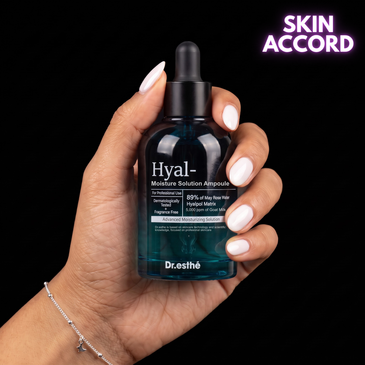 Hand holding Dr.Esthe Hyal Ampoule with the words "Skin Accord" in the background. 