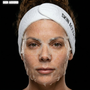 Person wearing a 'SKIN ACCORD' headband with a HOP 24k Gold Mask on their face against a black background.
