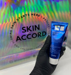 Picture of esthetician hand holding Dr.Esthe Rejuvenating Cream at Skin Accord
