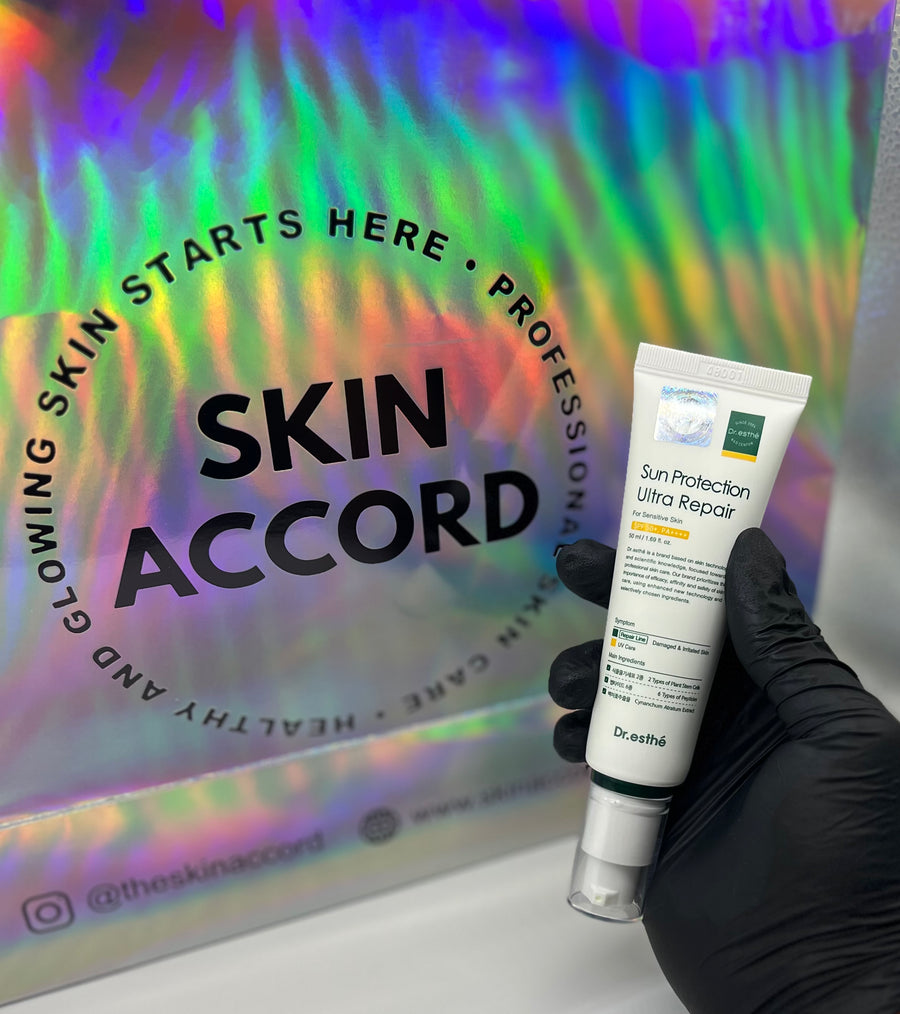 Picture of esthetician hand holding Dr. Esthe Sun Protection Ultra Repair Sunscreen at Skin Accord New Lenox, IL 