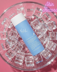 KRX Aesthetics Cryofacial mask bottle on ice cubes against a pink background, featuring 'Skin Accord' branding.