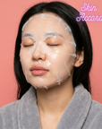 Woman wearing a face KRX Cica Home Mask with 'Skin Accord' branding on a pink background