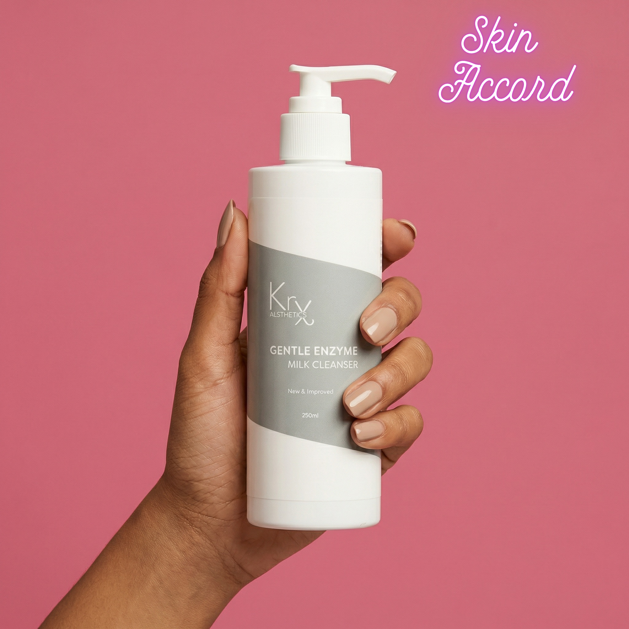 Hand holding KRX Aesthetics Gentle Enzyme Milk Cleanser against pink background with Skin Accord branding 