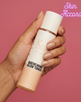 Hand holding a 'KRX Aesthetics Quenching Glow Toner' bottle with 'Skin Accord' branding on a pink background
