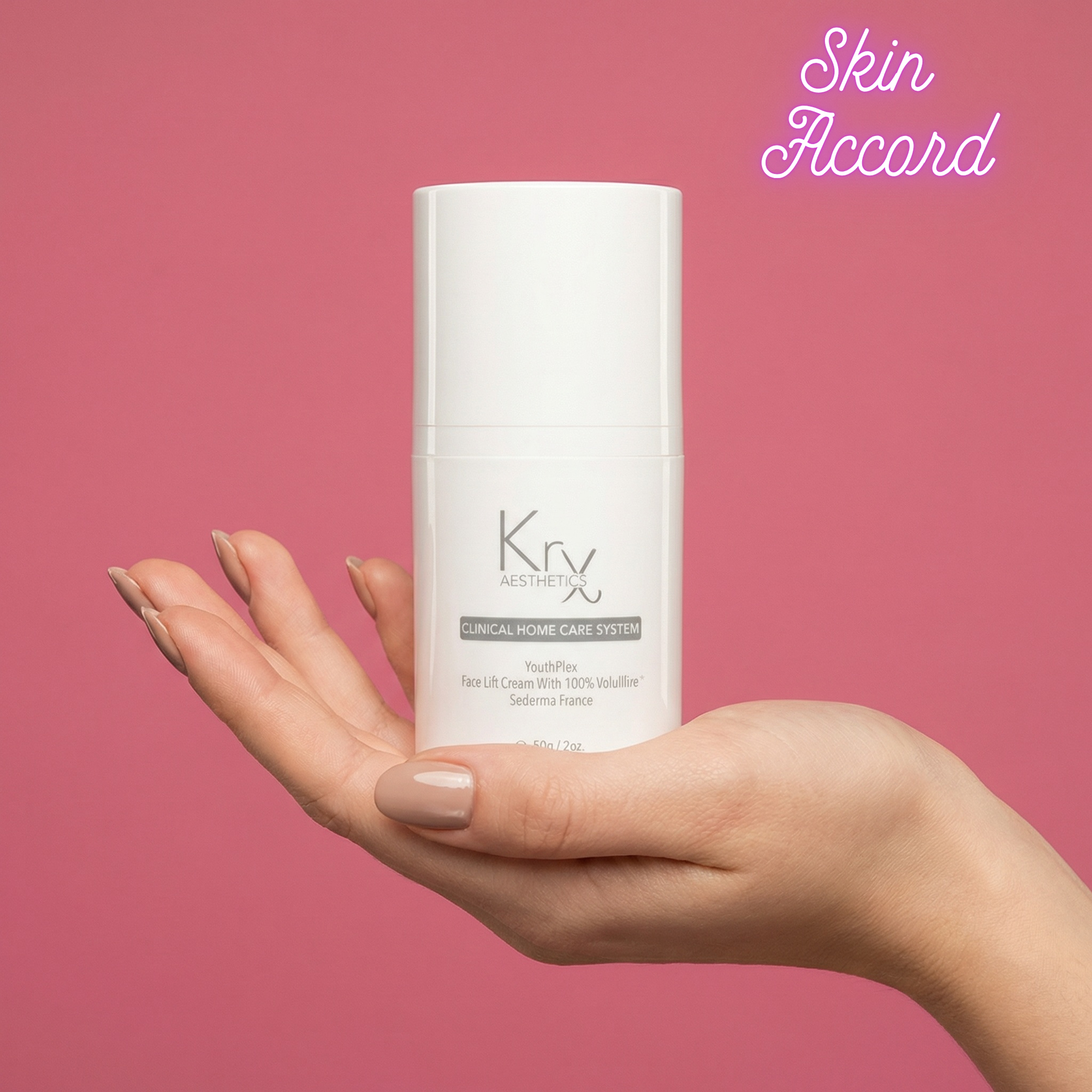 Hand holding KRX Youthplex Cream against pink background with Skin Accord branding 