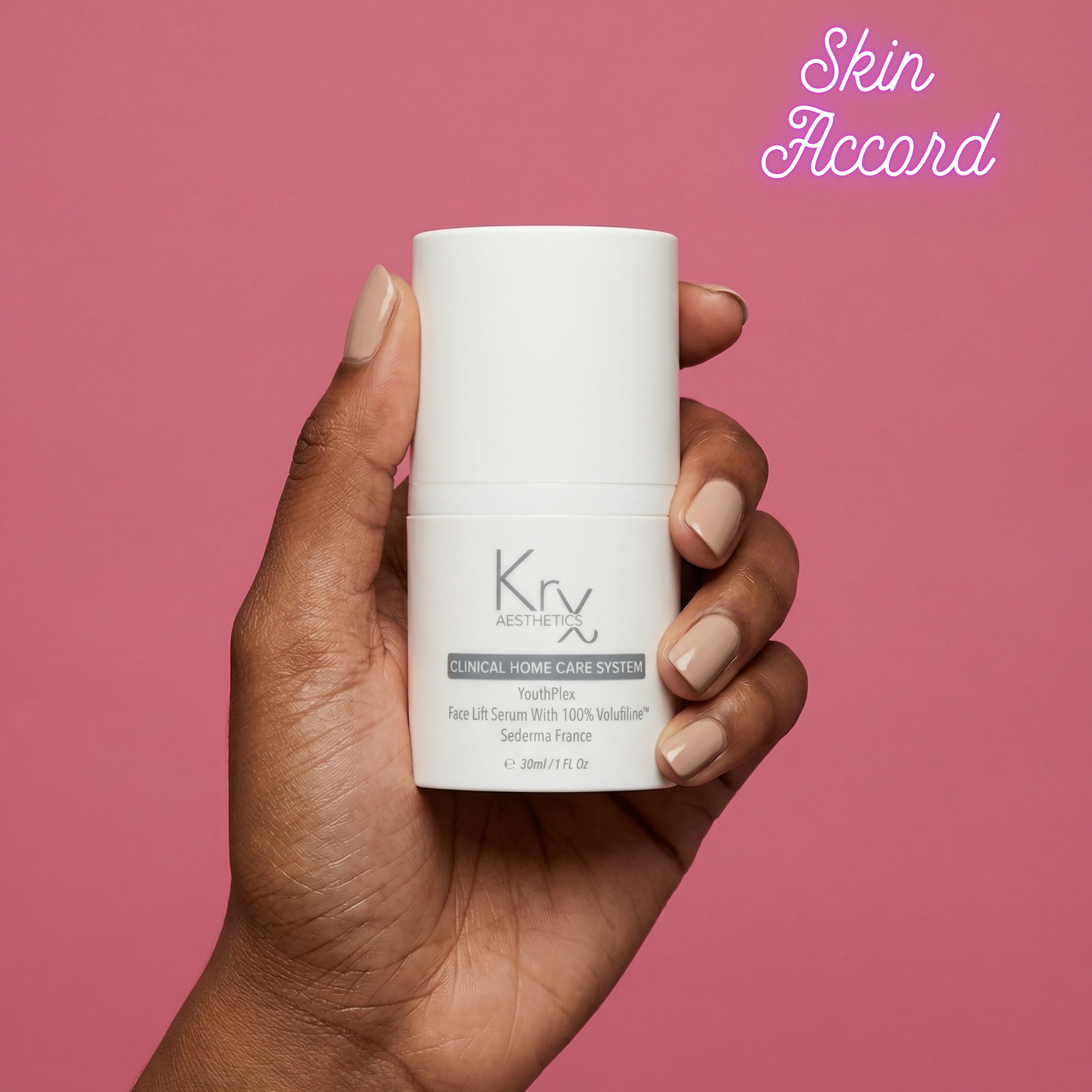 Hand holding a KRX Aesthetics Youthplex Serum against a pink background