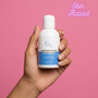 Hand holding a bottle of KRX Probiotic Cream against a pink background with 'Skin Accord' branding.