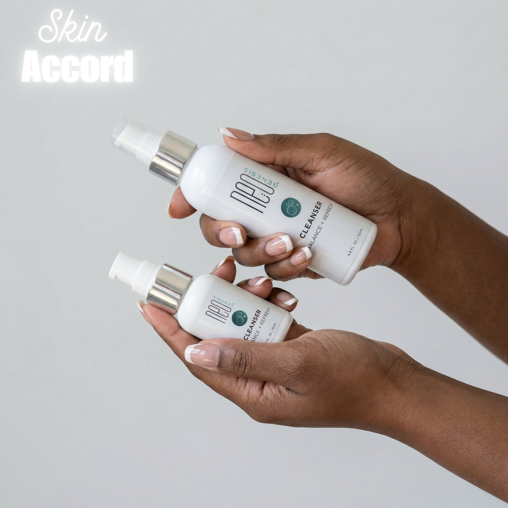 Two bottles of NeoGenesis Cleansers skincare products held by a person against a light gray background.